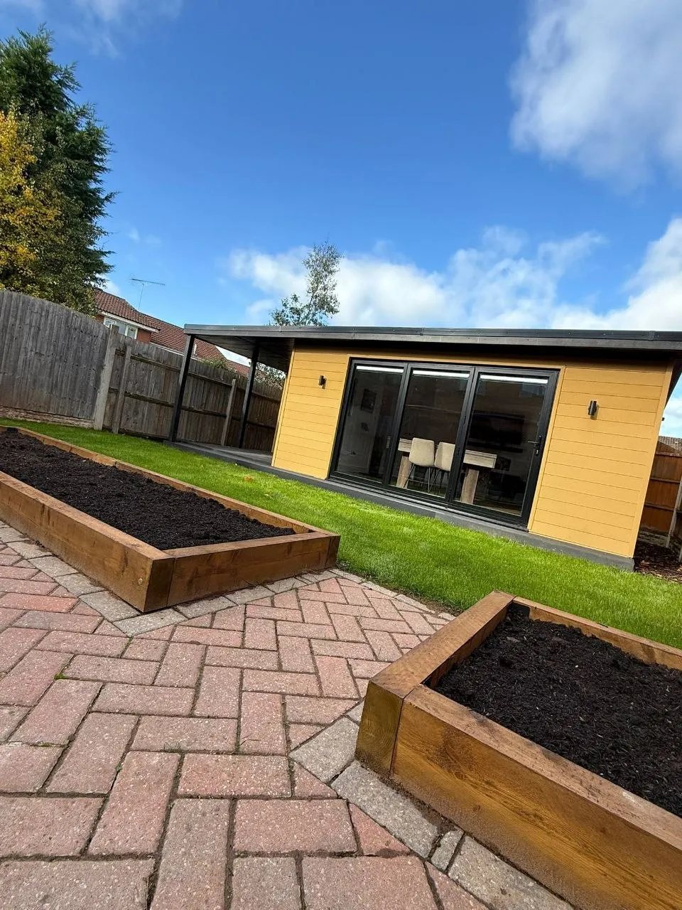 Insulated garden room with cedar cladding built by LouMil in Worcester