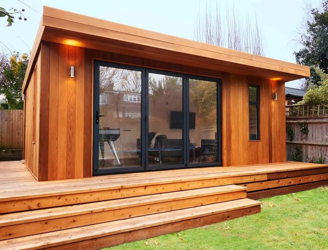 Cedar garden room with bifold doors and decking